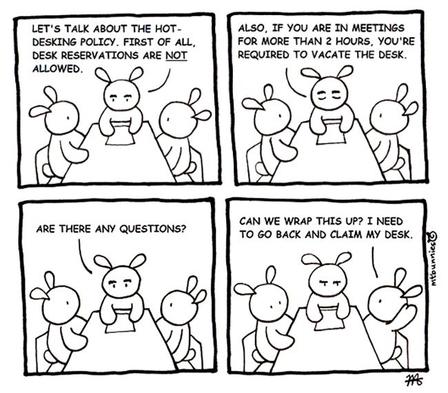 Comic strip. Three rabbits in a meeting. The manager says that desks cannot be reserved and that all desks must be vacated for absences of 2 hours or more. A rabbit asks if he can go back to sit down to keep his desk.