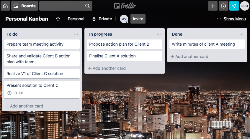 On a city wallpaper illuminated at night, three columns: to do, in progress and done, with cards in each.
