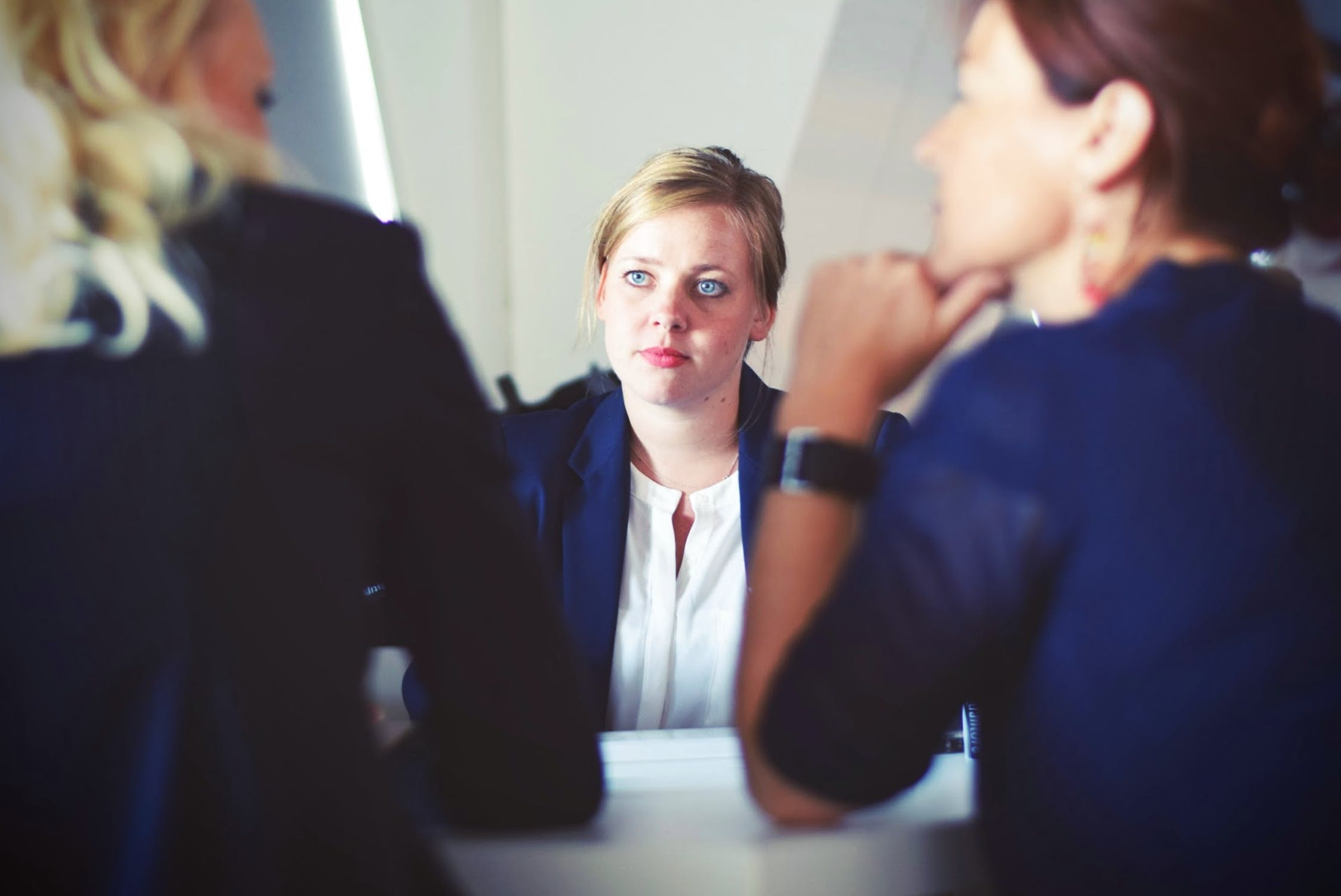 Woman looking at others questionning her